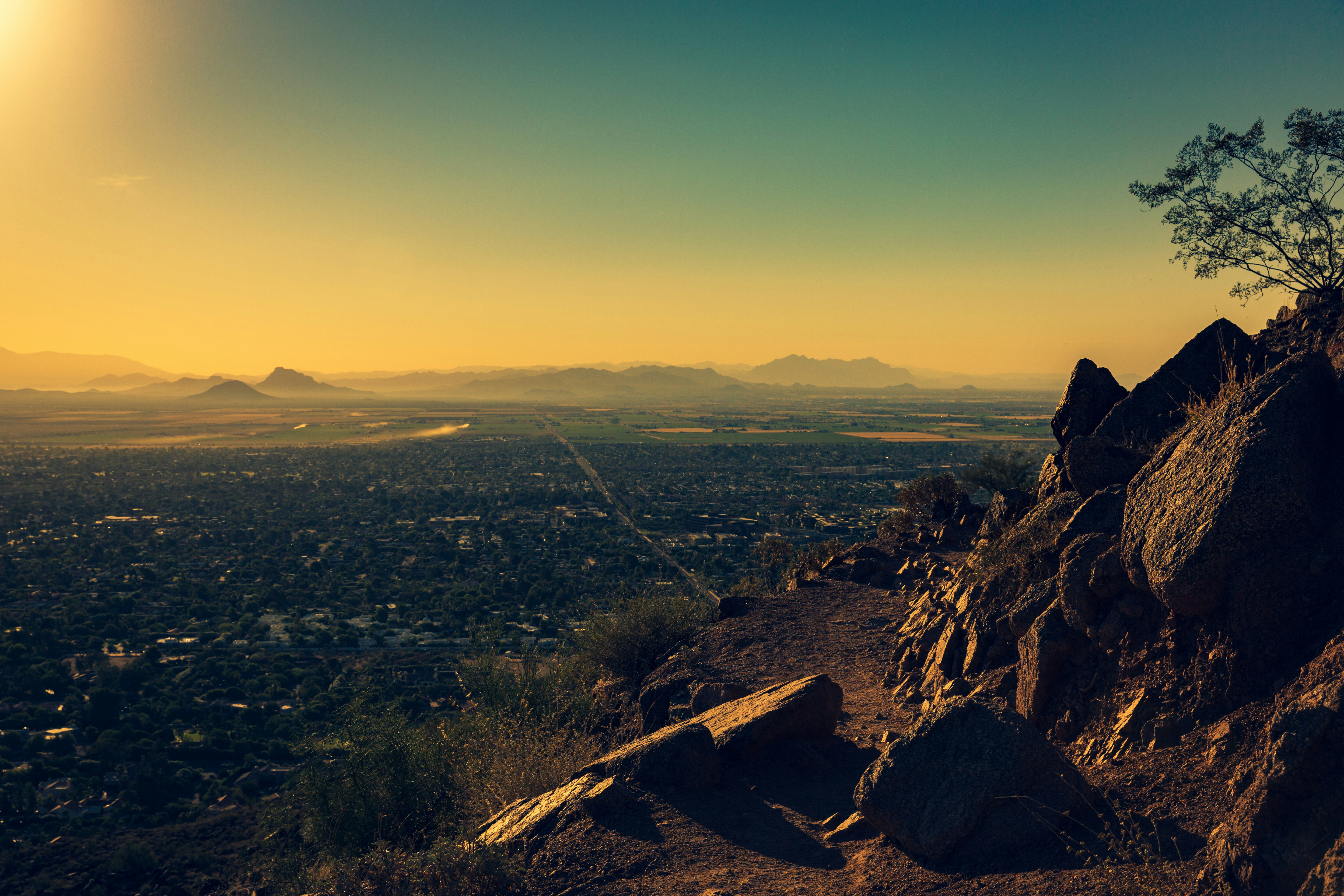 photo of city by rock formations